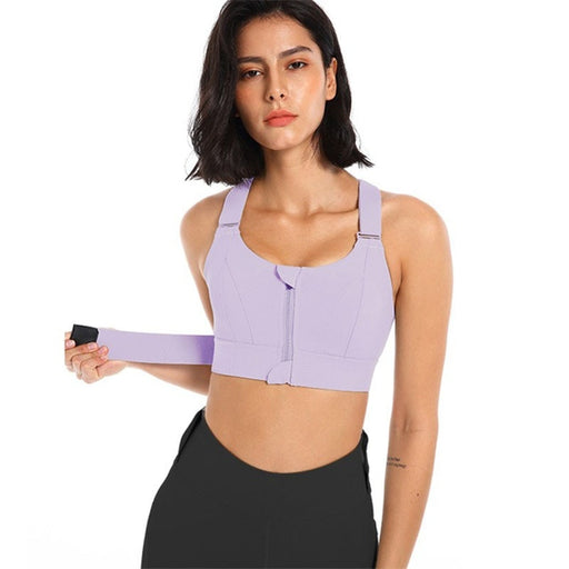 A woman wearing a purple sports bra top