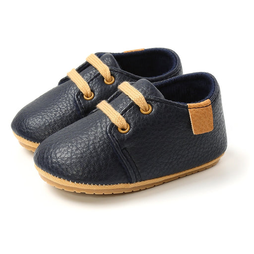 Baby shoes with leather soles and laces - perfect for tiny feet. Comfortable and stylish footwear for your little one.
